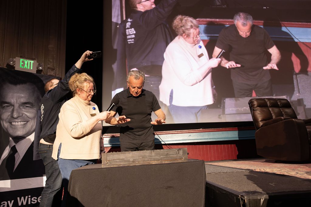 Beth Burrows assisting Ray Wise with the handprint ceremony