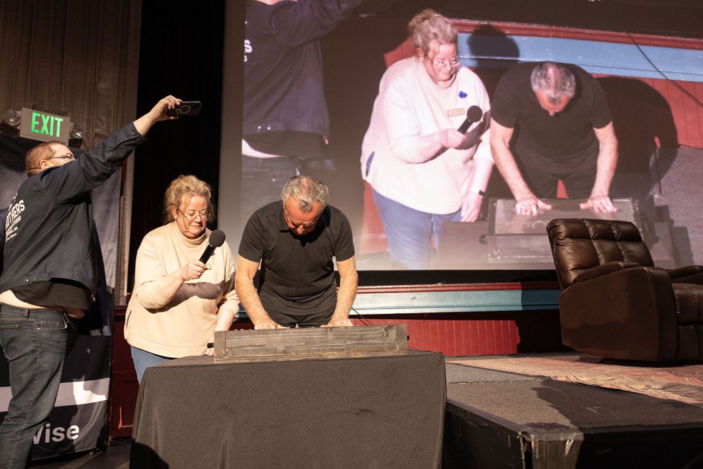 Beth Burrows assisting Ray Wise with the handprint ceremony