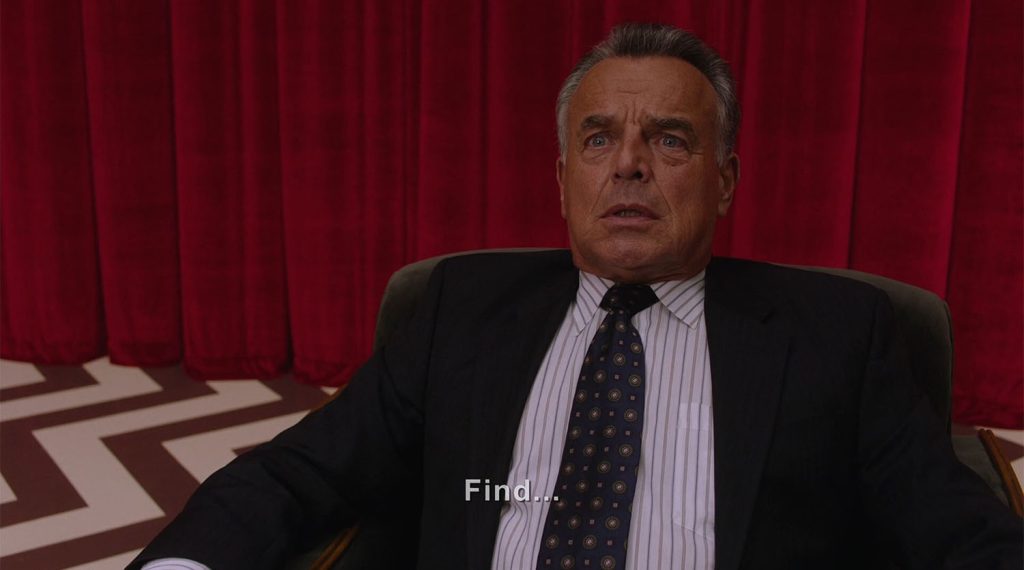 Leland Palmer sitting in the Red Room saying "Find"