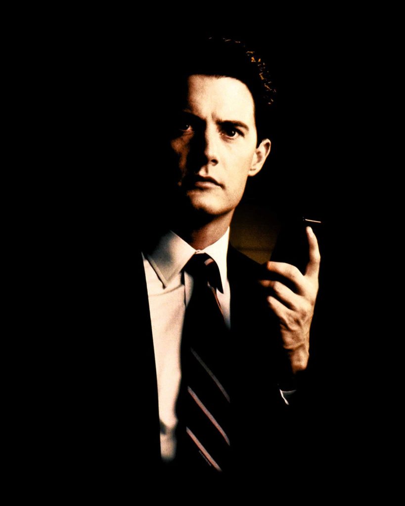 Agent Cooper holding a tape recorder