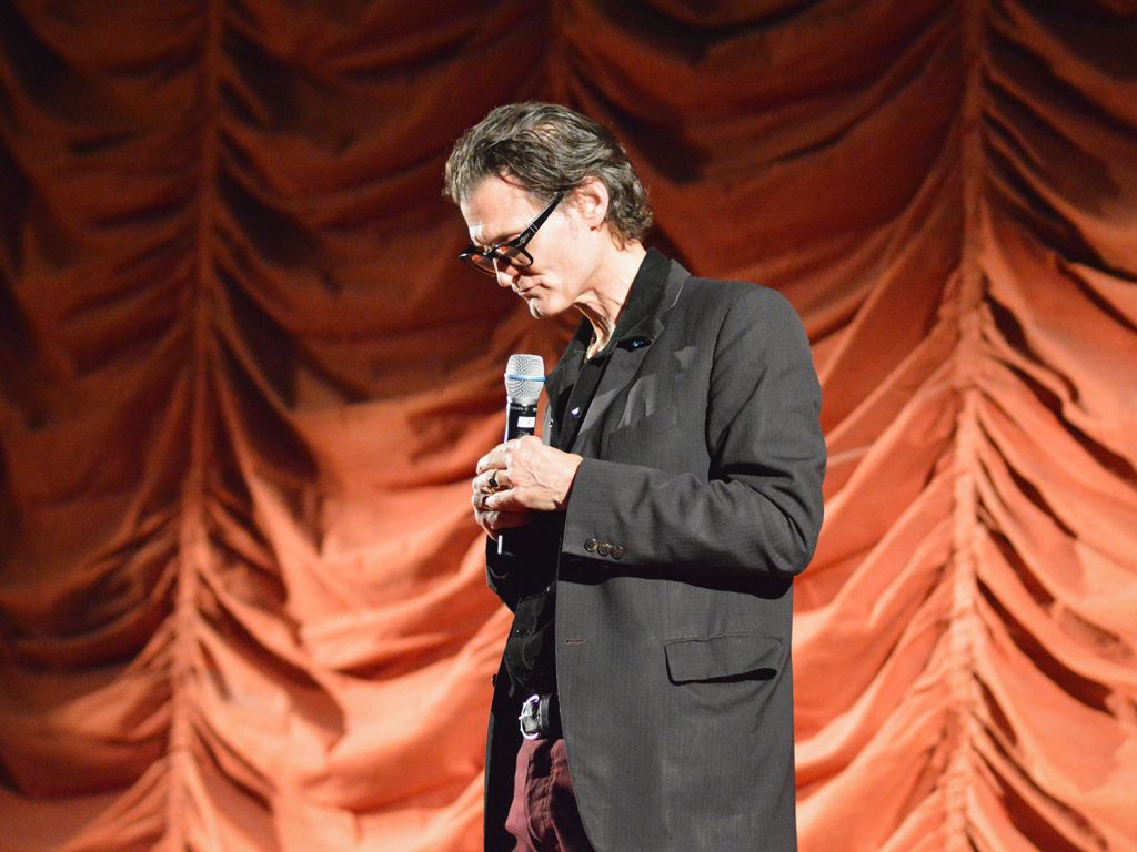 George Griffith standing on stage
