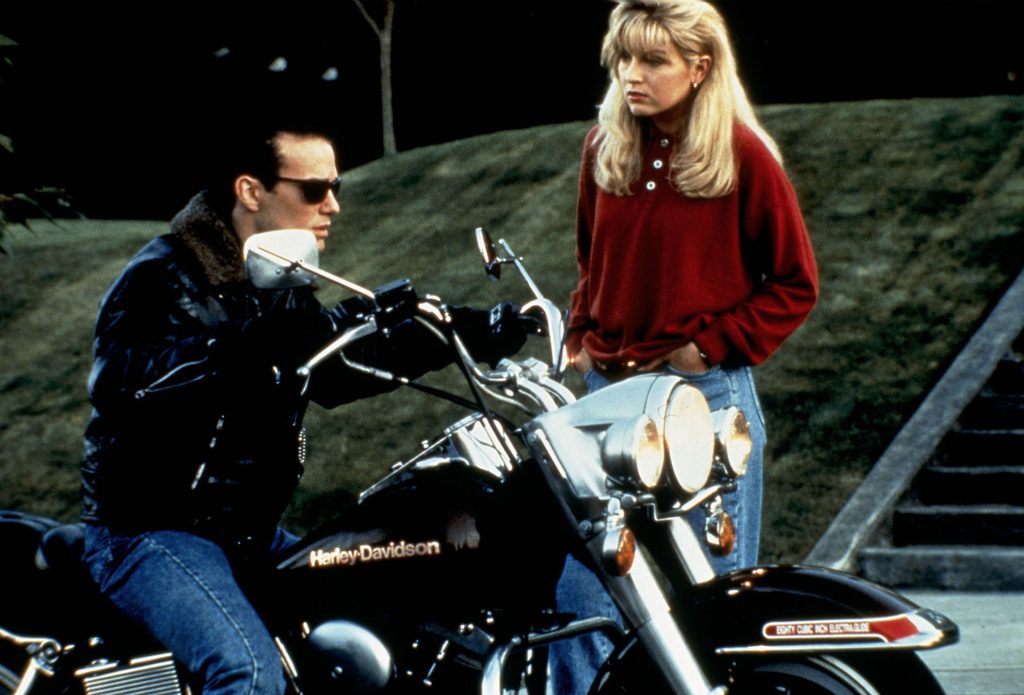 James Hurley on his motorcycle talking to Laura Palmer outside her home