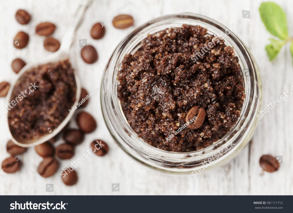 Coffee in a jar with coffee grounds on a spoon