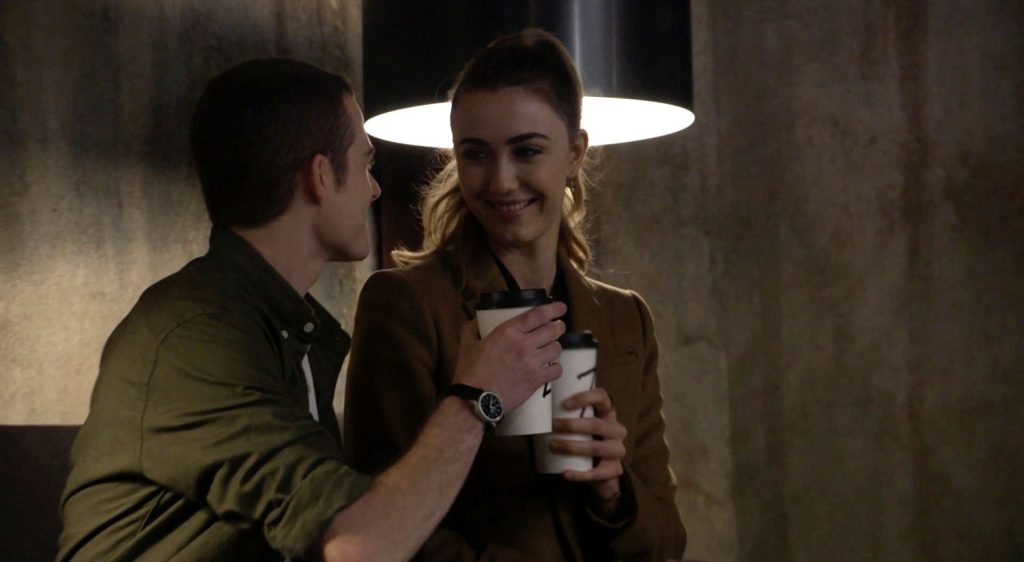 Sam and Tracey raising coffee mugs