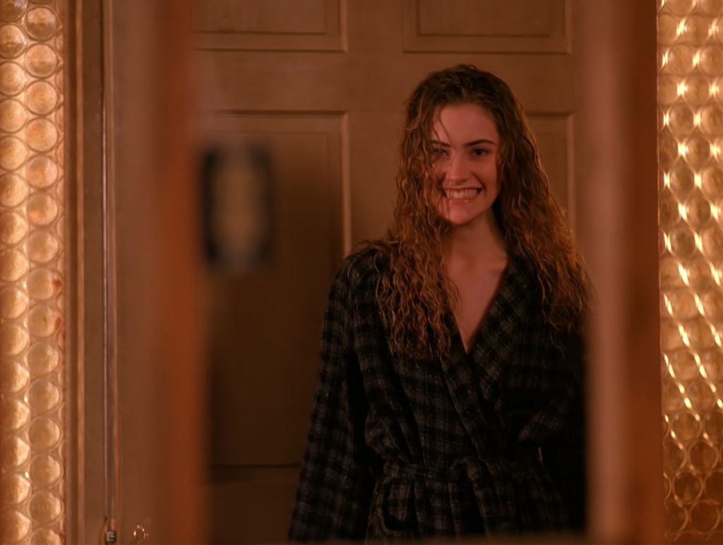 Shelly Johnson by front door of her home