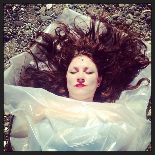 Mary Hutter wrapped in plastic