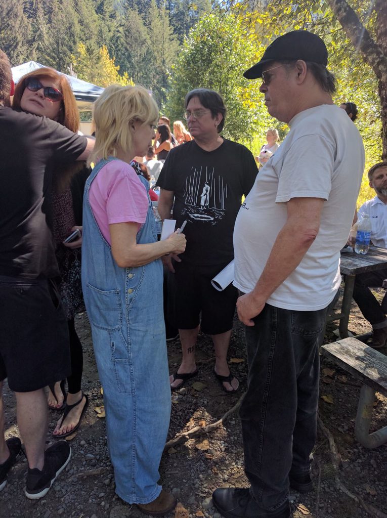 Julee Cruise speaking with people at a picnic
