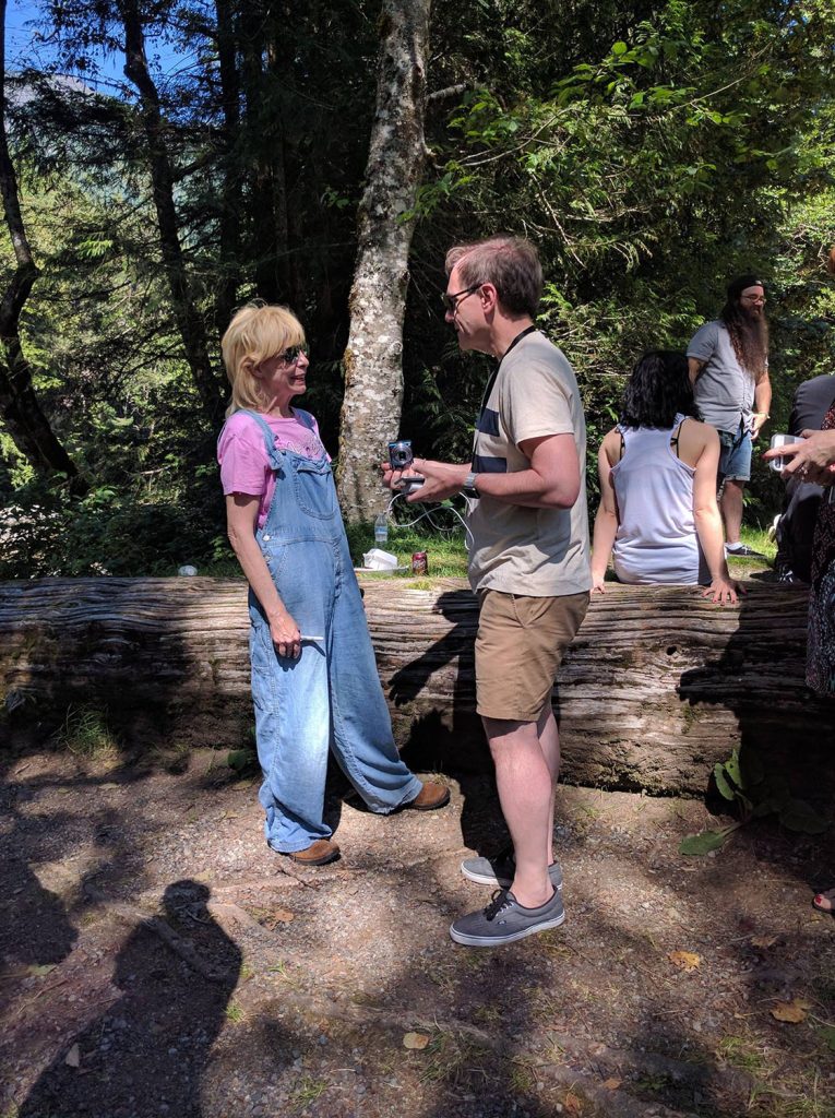 Julee Cruise speaking with people at a picnic