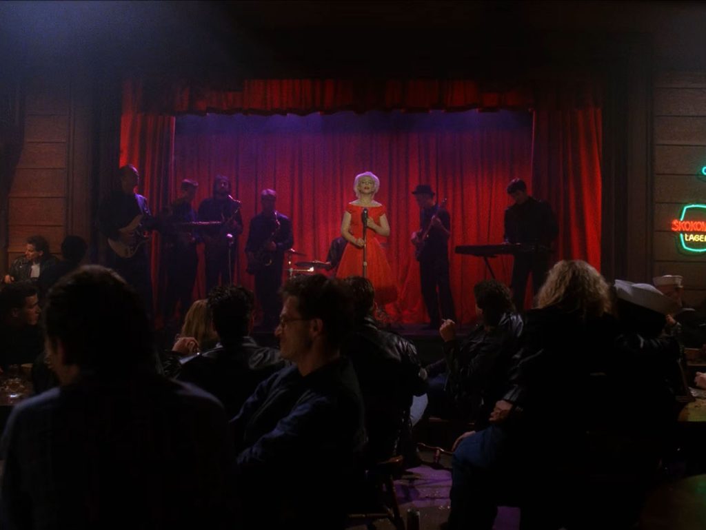Julee Cruise on stage with a band