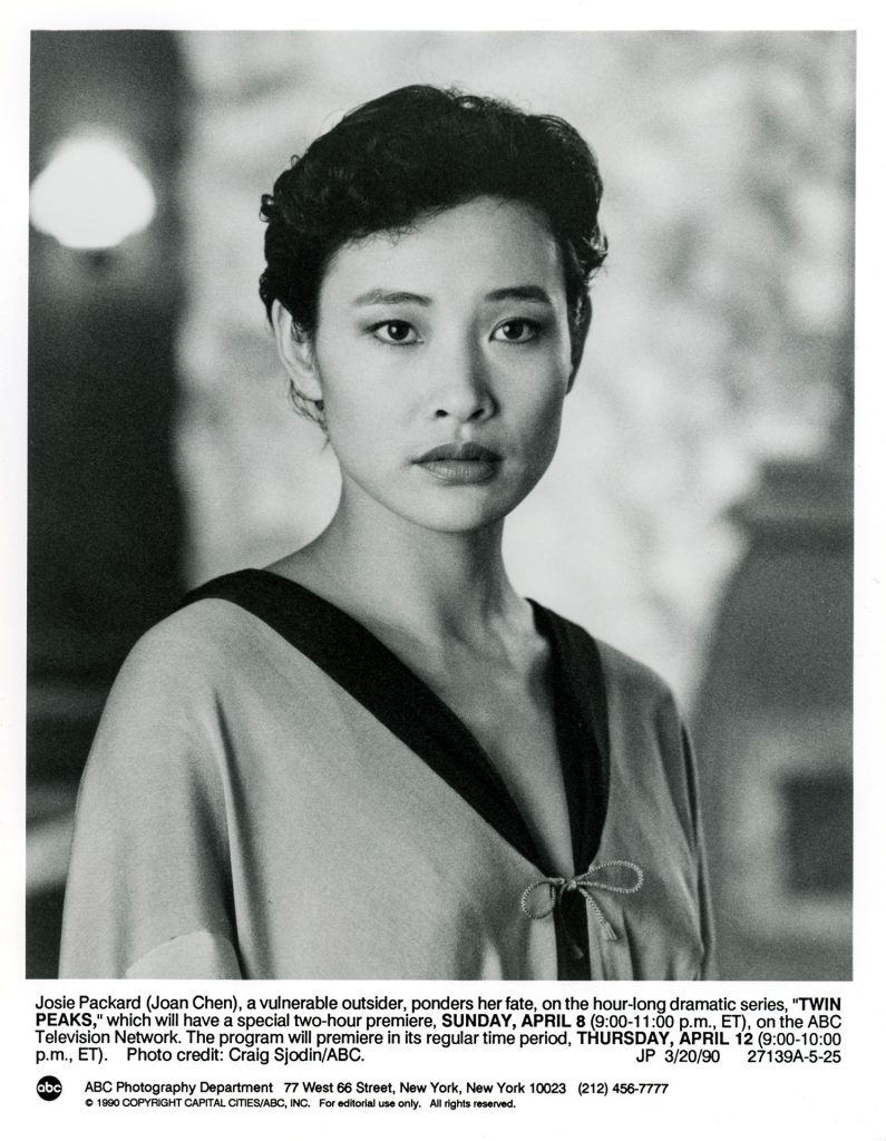 Josie Packard in a robe at the Blue Pine Lodge