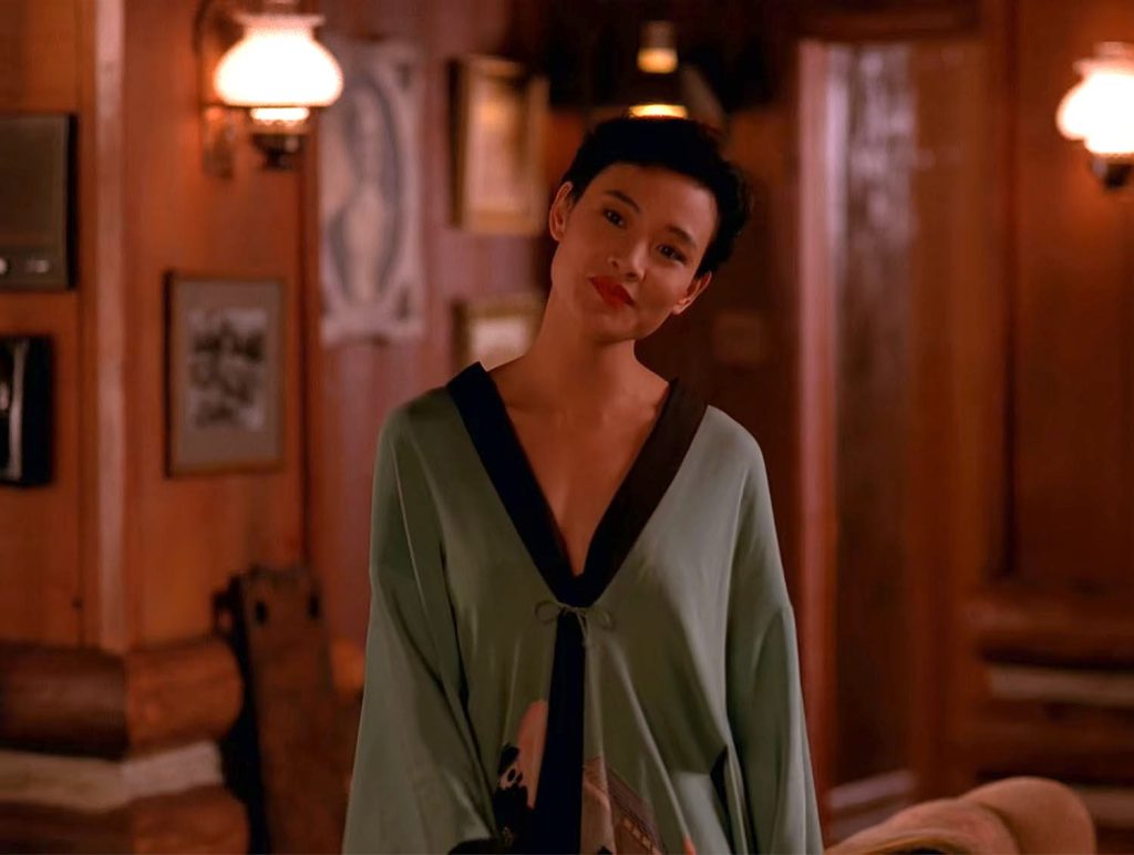 Josie Packard in a robe at the Blue Pine Lodge