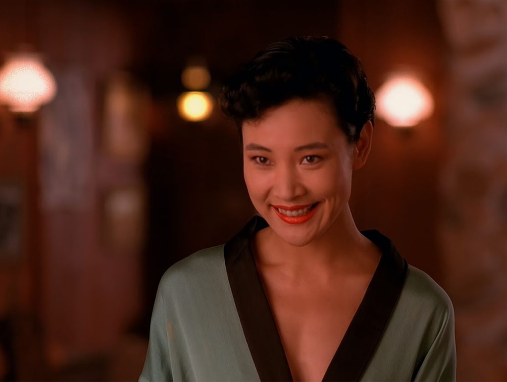 Josie Packard in a robe at the Blue Pine Lodge