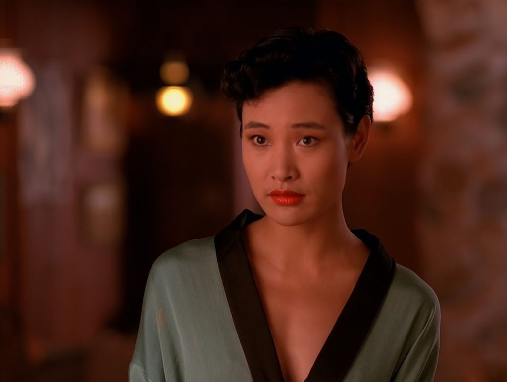 Josie Packard in a robe at the Blue Pine Lodge