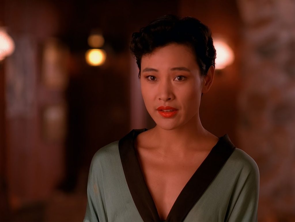 Josie Packard in a robe at the Blue Pine Lodge