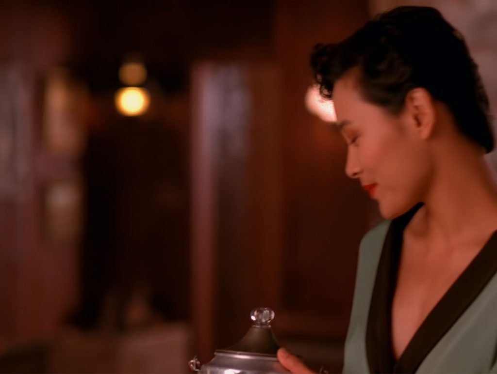 Josie Packard in a robe at the Blue Pine Lodge