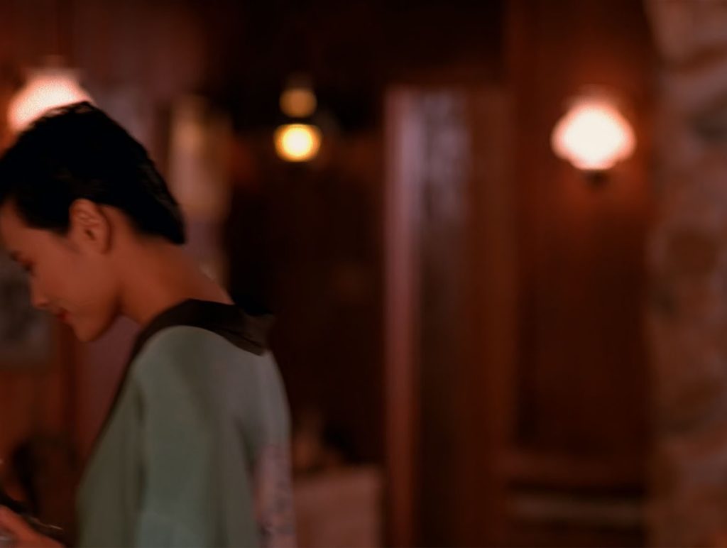 Josie Packard in a robe at the Blue Pine Lodge