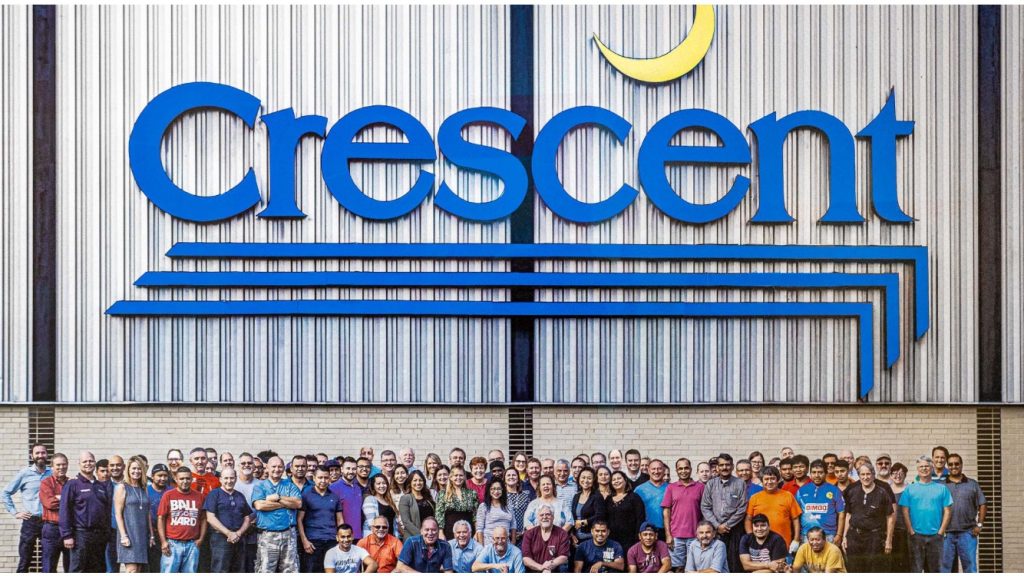 People standing outside Crescent factory building