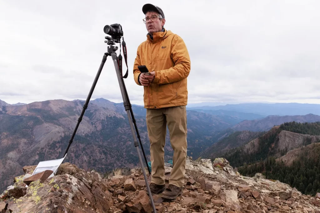 Photographer John Marshall prepares to take a series of overlapping photographs from the summit of Koppen Mountain.
