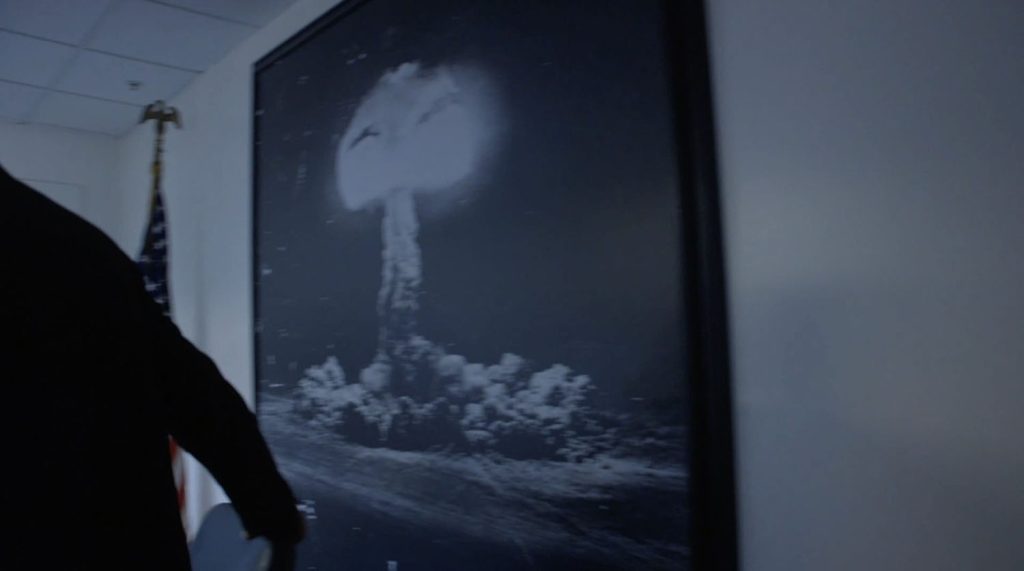 Framed nuclear explosion image on the wall