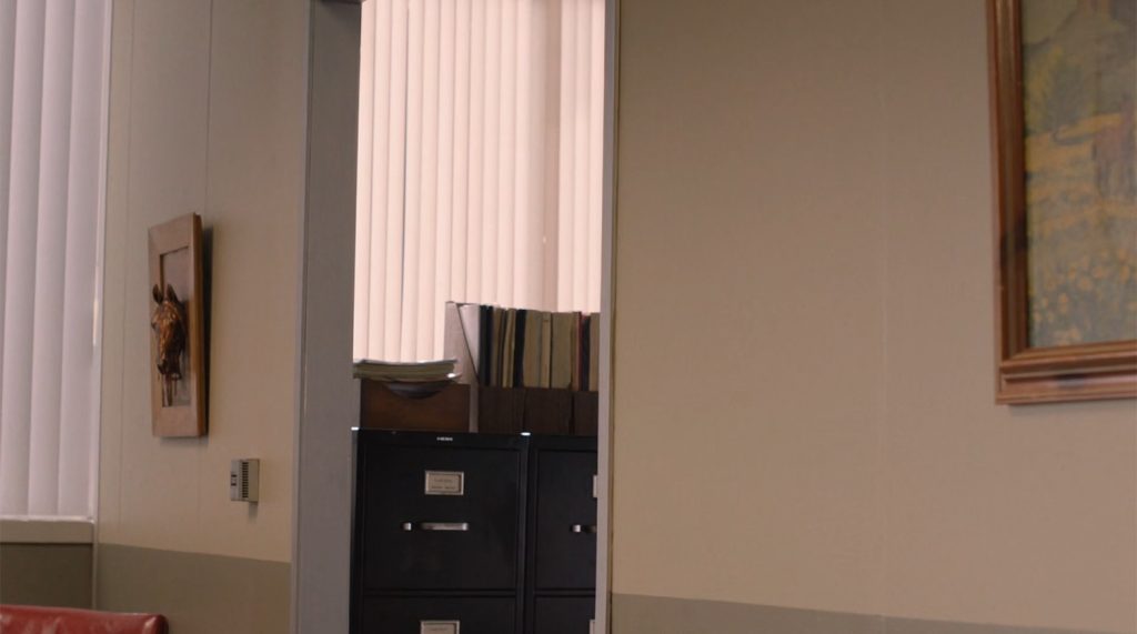 Empty office with artwork on the wall