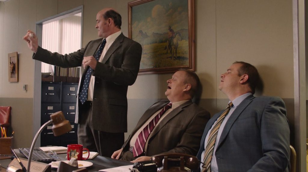 Fusco brothers looking as one throws a paper ball