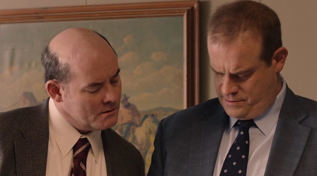 Fusco brothers looking at paperwork