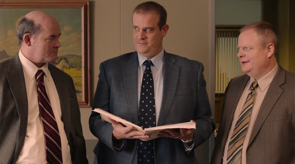 Fusco brothers looking at paperwork