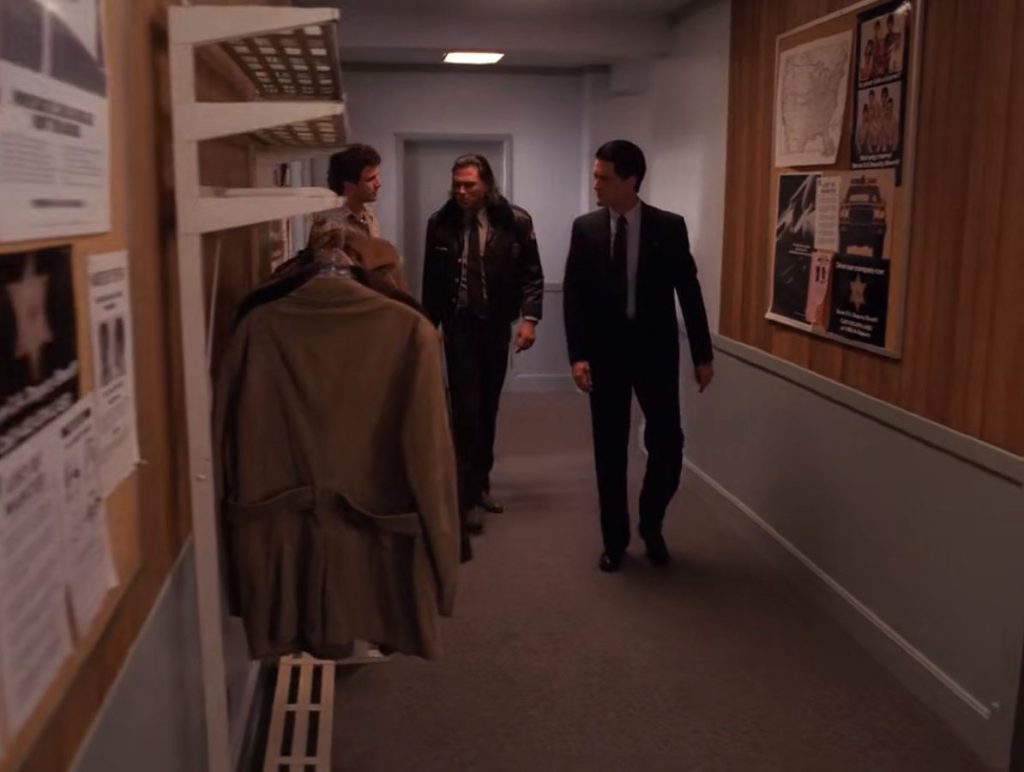 Truman, Hawk and Cooper walk down hall of Twin Peaks Sheriff's Department