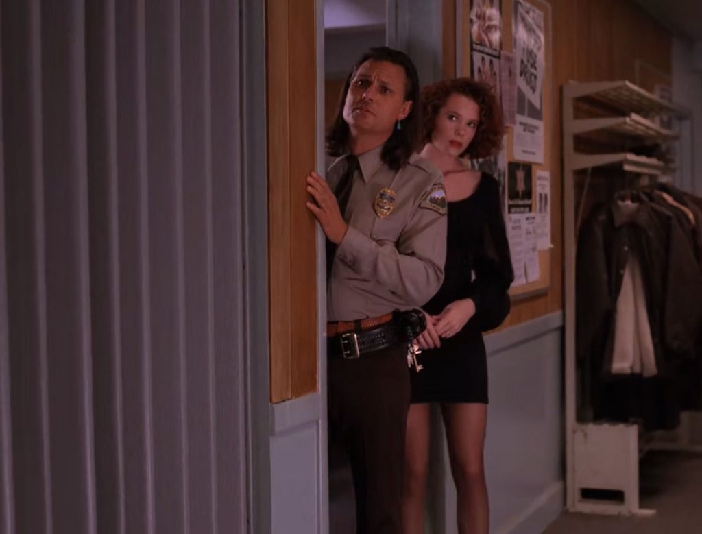 Hawk and Lana in conference room door