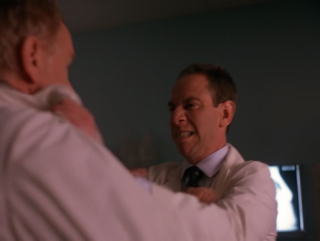 Albert Rosenfield grabs Dr. Hayward