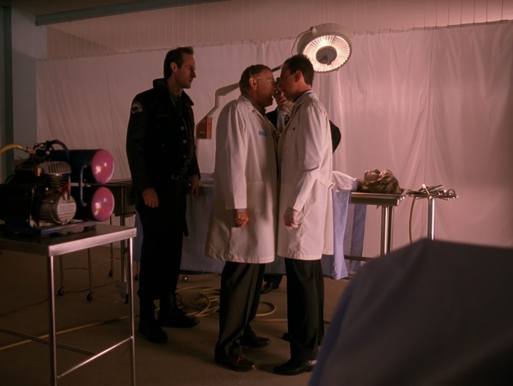 Albert Rosenfield confronts Dr. Hayward while Andy Brennan watches