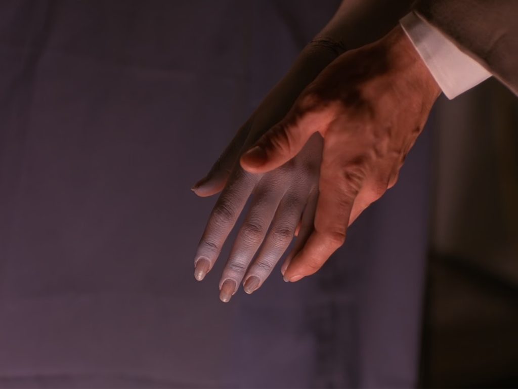 Cooper grabs Laura's hand