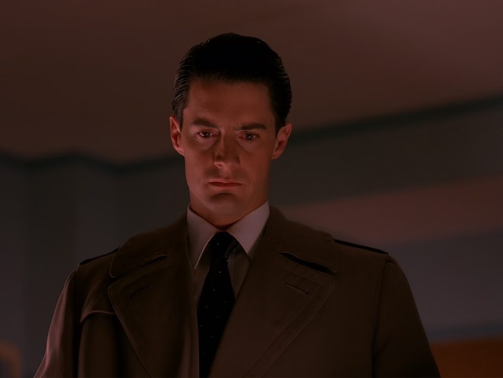 Cooper looking down at Laura