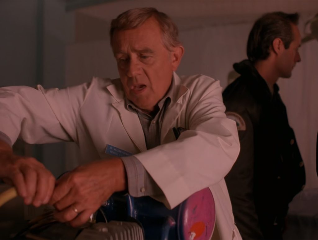 Dr. Hayward disconnects hose