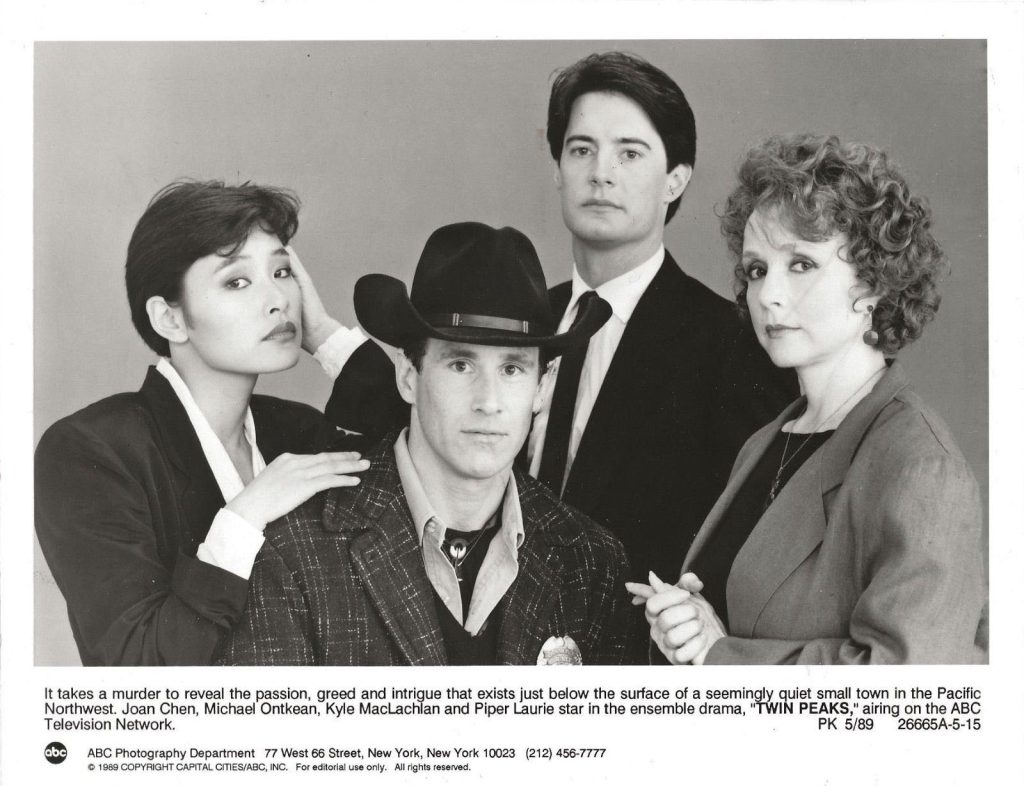 Black and white publicity photo of Josie Packard, Sheriff Truman, Agent Cooper and Catherine Martell