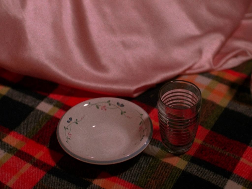 Nadine next to a cup and bowl