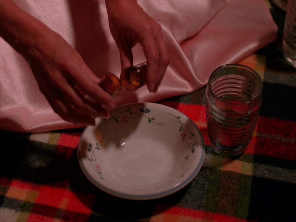 Nadine pouring pills into a bowl