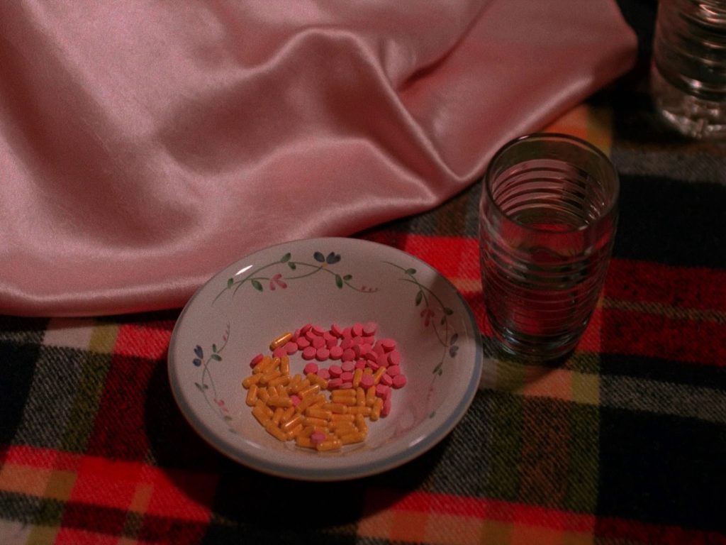 Nadine pouring pills into a bowl