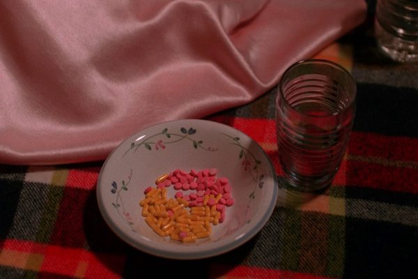 Nadine pouring pills into a bowl