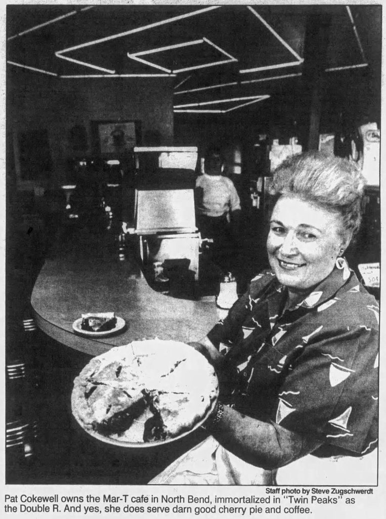 Pat Cokewell holding cherry pie at Mar-T Cafe
