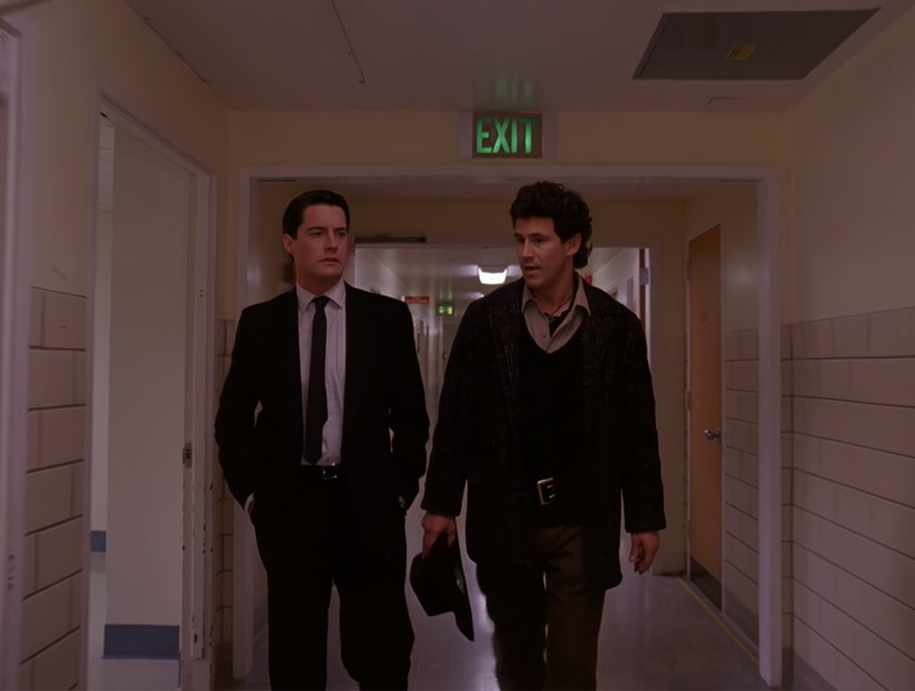 Special Agent Dale Cooper and Sheriff Harry S. Truman walking down the hall