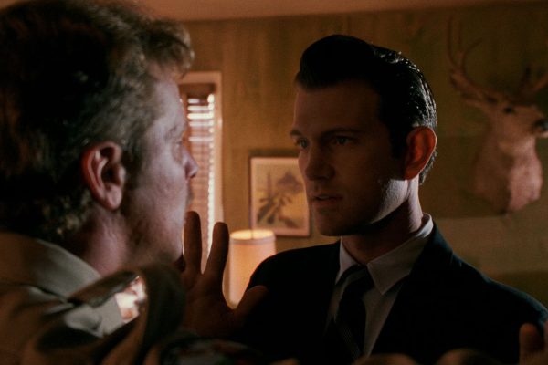 Agent Desmond grabbing Deputy Cliff's nose