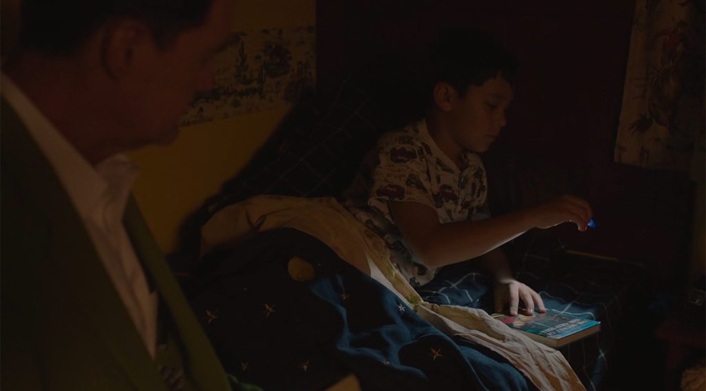 Sonny Jim Jones reading in bed