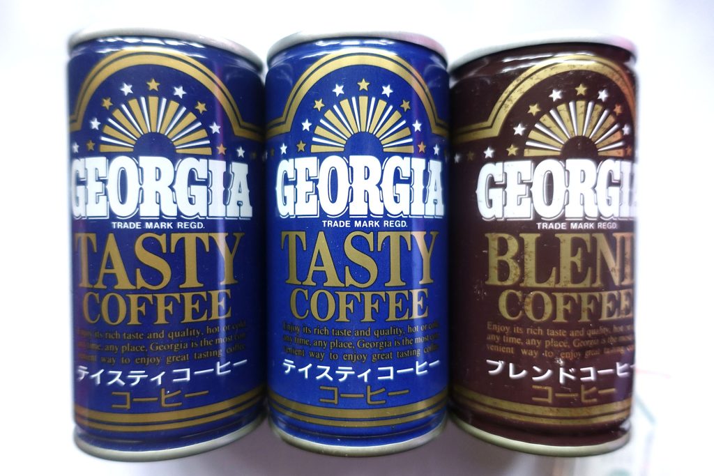 Three Georgia Coffee cans