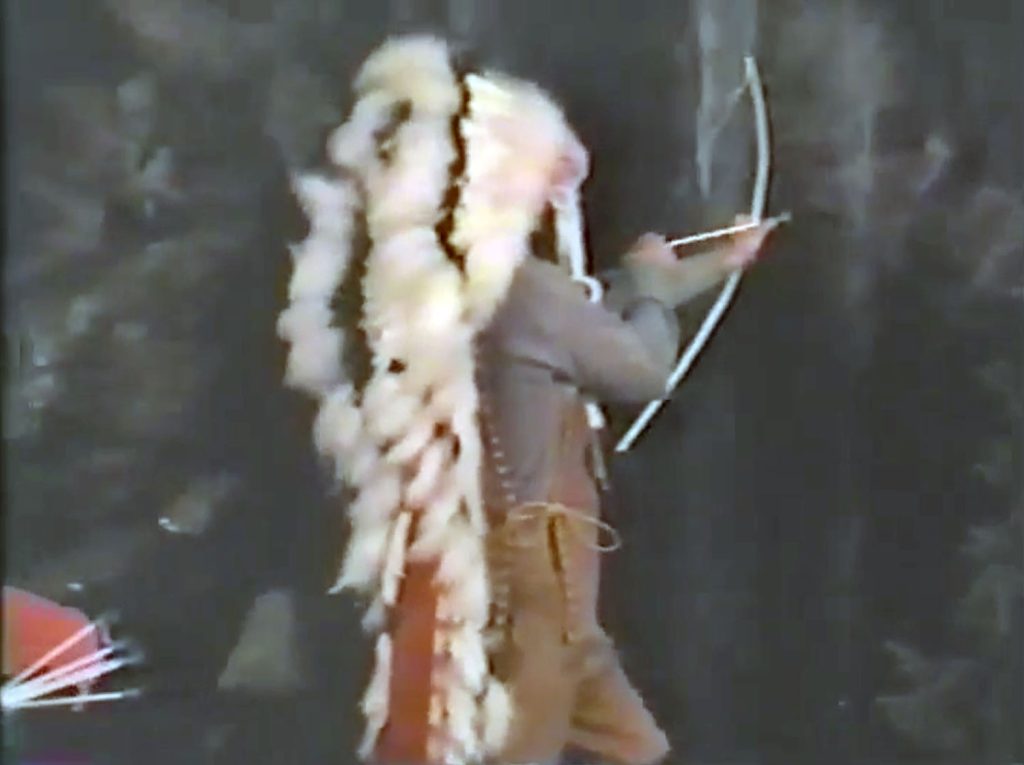 Johnny Horne standing by a waterfall