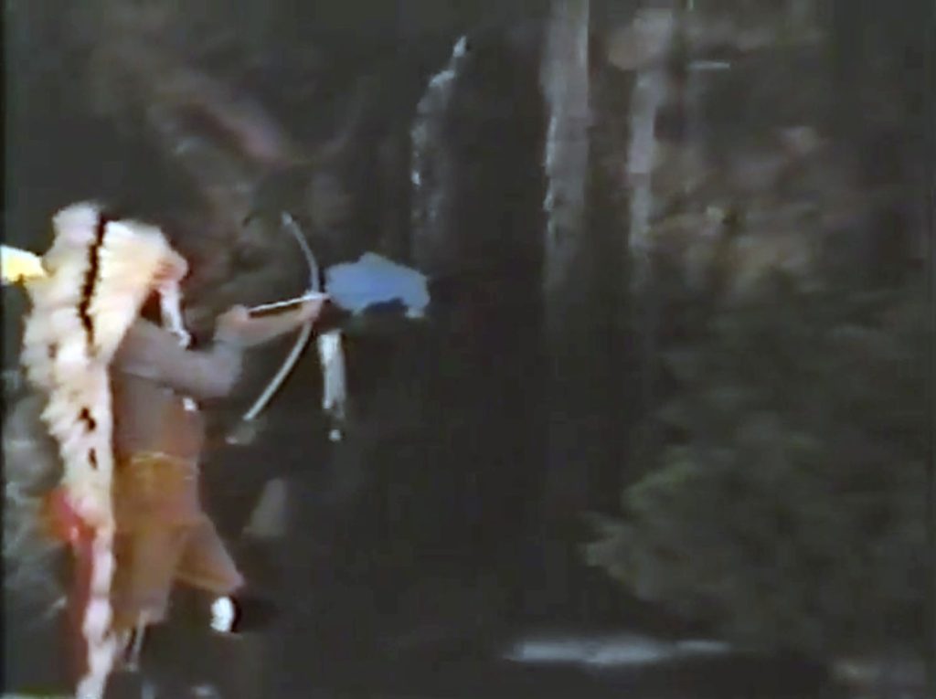 Johnny Horne standing by a waterfall