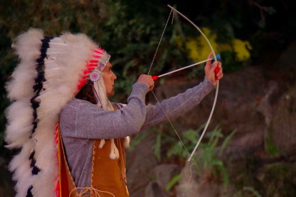 Johnny Horne with a toy bow and arrow