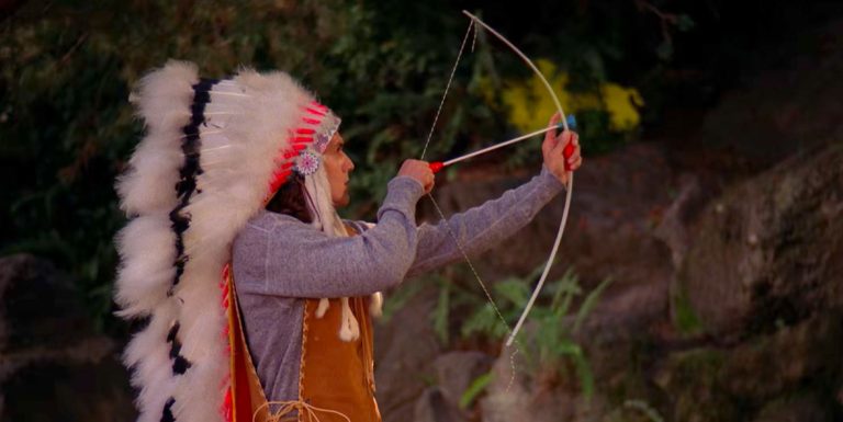 Johnny Horne with a toy bow and arrow