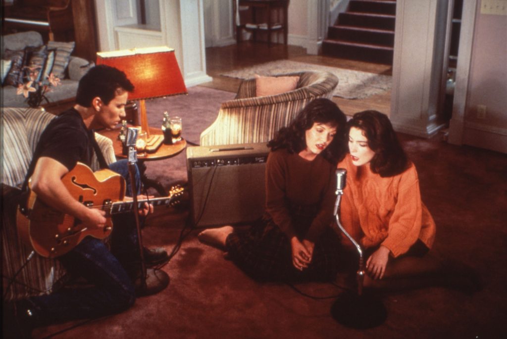 James Hurley, Maddy Ferguson and Donna Hayward singing