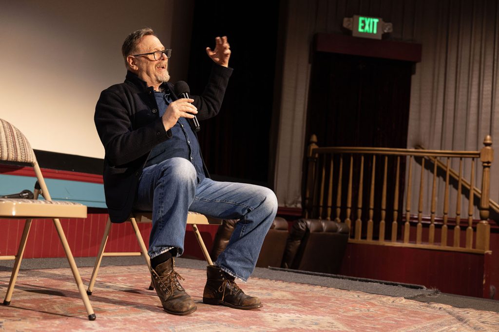 Richard Green on stage speaking